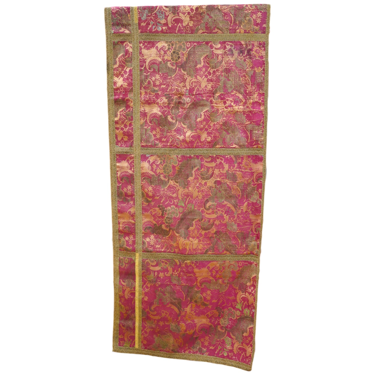 A fine 17th century Italian crimson silk brocade wall hanging, originally woven with gold threads and polychrome silks in a large ornate floral pattern, possibly part of a larger hanging, the front now edged with later n